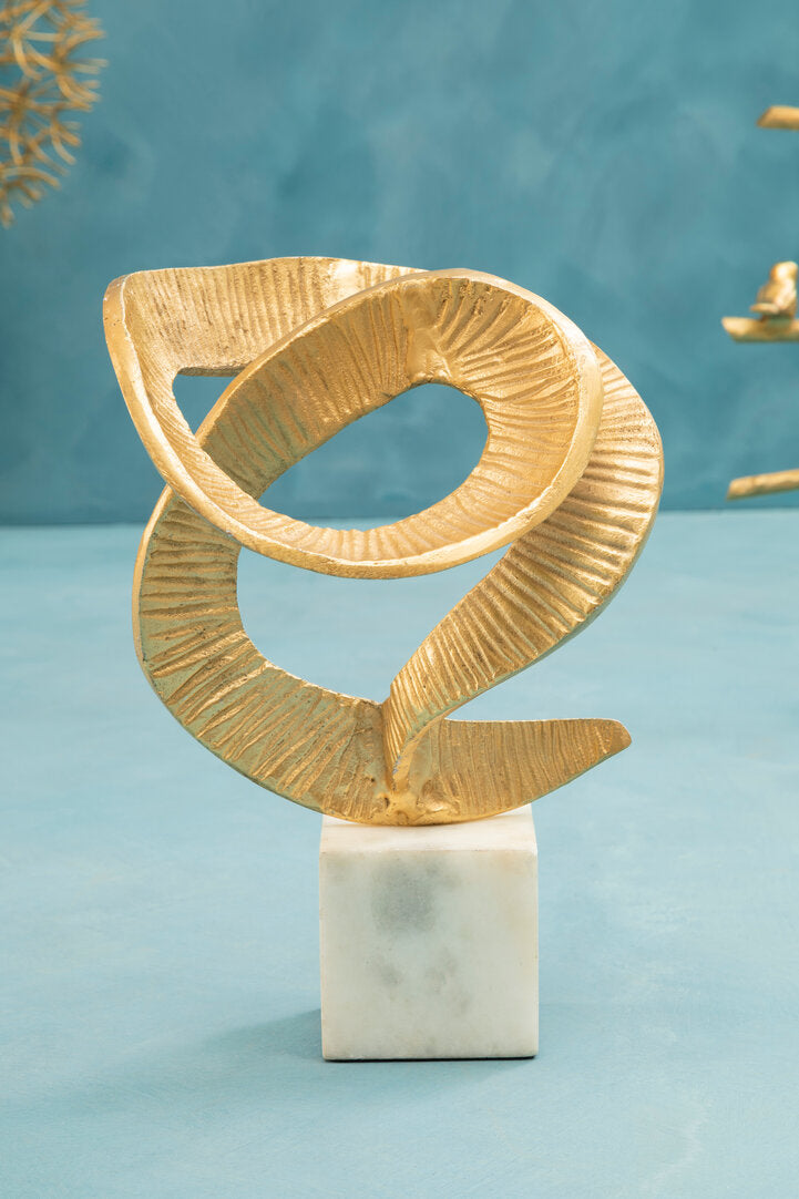 Evra Gold Sculpture On White Marble Base - Lifestyle