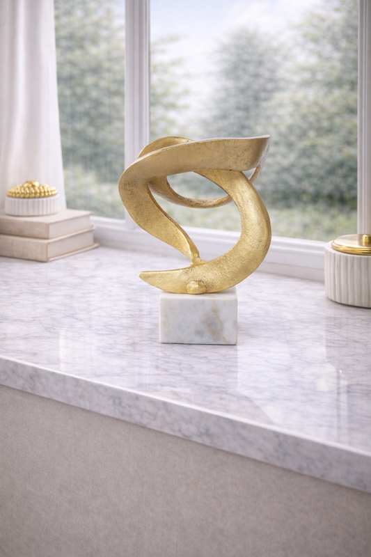 Evra Gold Sculpture On White Marble Base