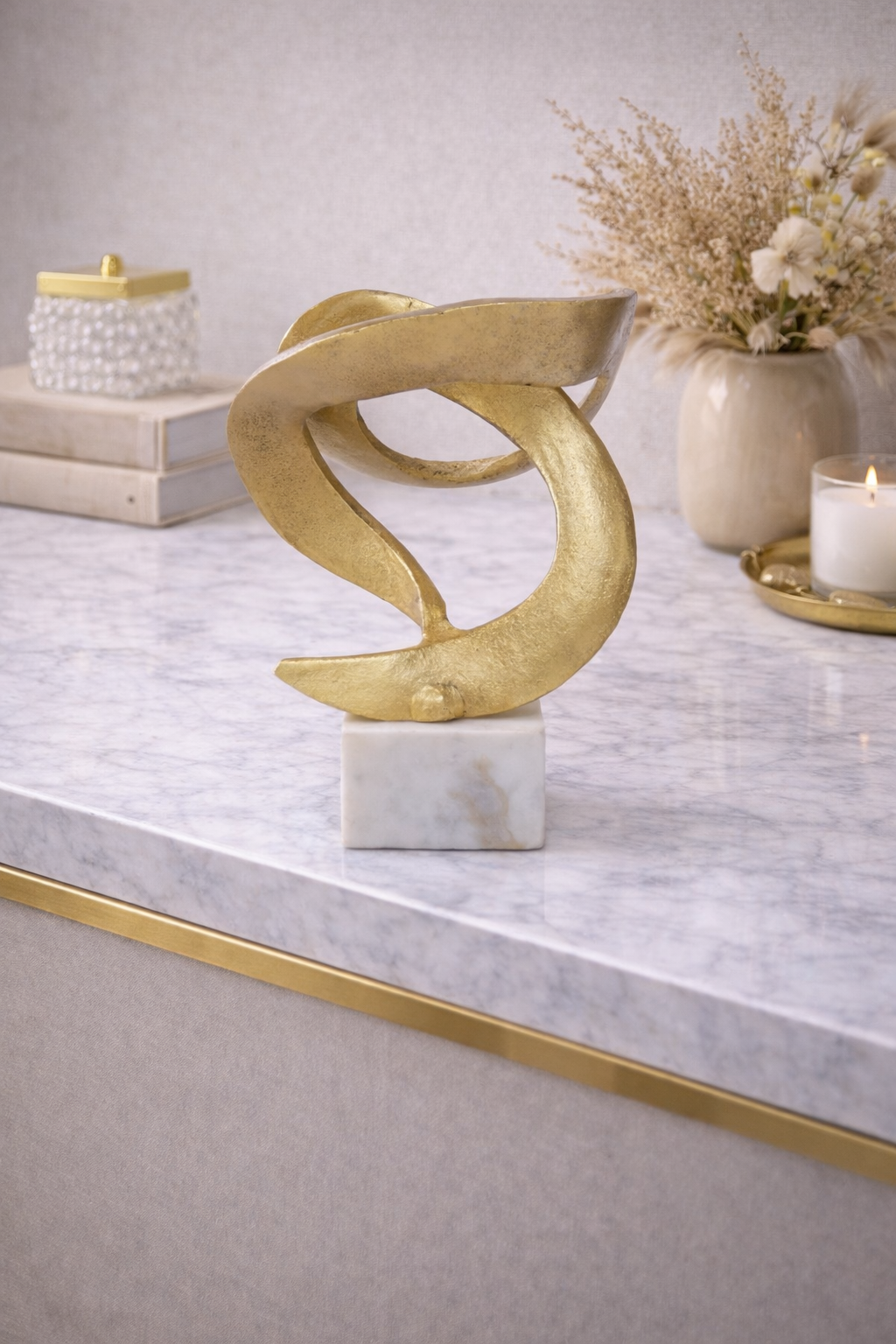 Evra Gold Sculpture On White Marble Base